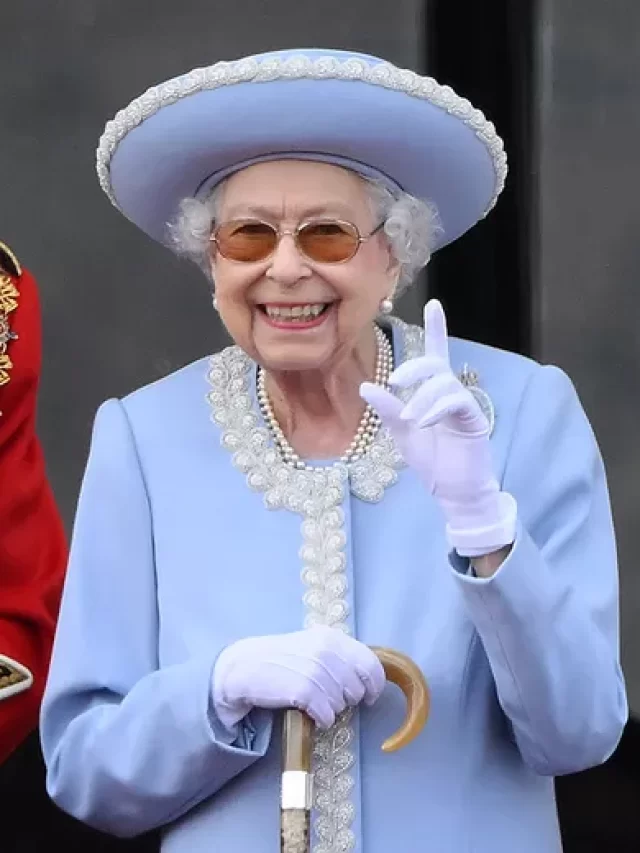 99427908-topshot-britains-queen-elizabeth-ii-reacts-as-she-watches-a-special-flypast-from-bucking