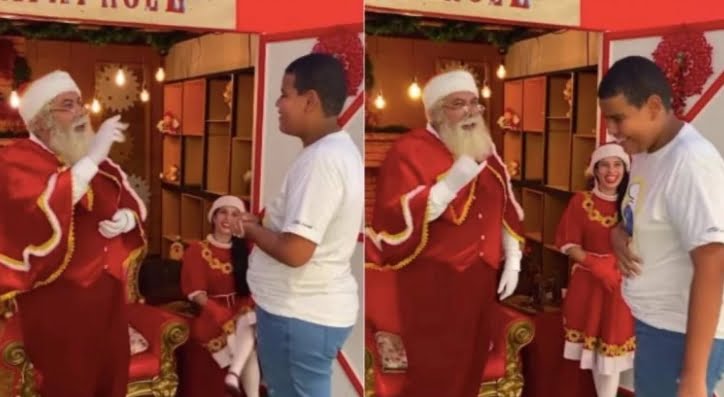 Jovem se comunica com Papai Noel em Libras