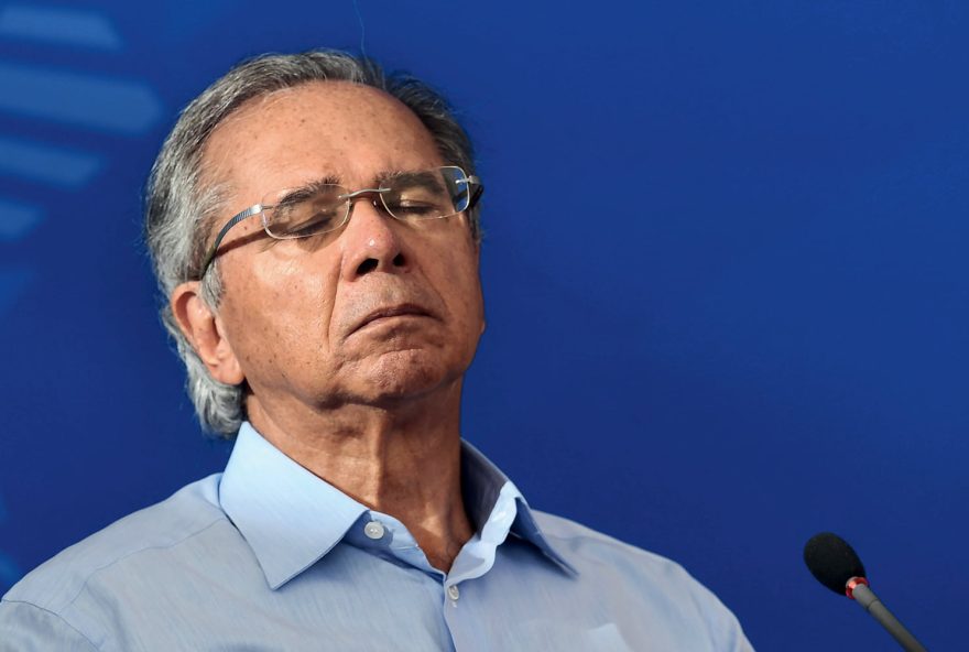 (FILES) In this file picture taken on April 3, 2020 Brazil's Minister of Economy Paulo Guedes gestures during a press conference at Planalto Palace in Brasilia. - Guedes, the powerful free-market guru to far-right President Jair Bolsonaro, said on August 11, 2020 that two of his top deputies had resigned in a 