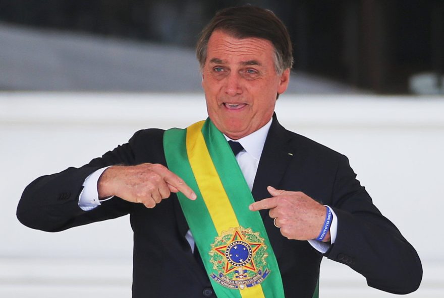 Brazil's new President Jair Bolsonaro gestures after receiving the presidential sash from outgoing President Michel Temer at the Planalto Palace, in Brasilia, Brazil January 1, 2019. REUTERS/Sergio Moraes