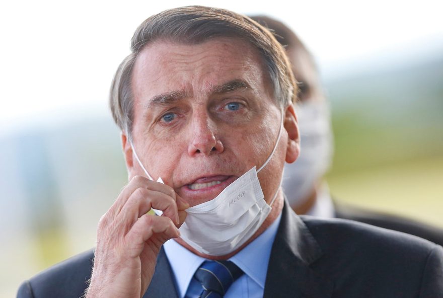 Brazil's President Jair Bolsonaro adjusts his mask as he leaves Alvorada Palace, amid the coronavirus disease (COVID-19) outbreak in Brasilia, Brazil May 13, 2020. REUTERS/Adriano Machado     TPX IMAGES OF THE DAY