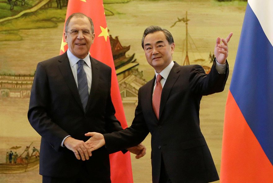 Russian Foreign Minister Sergei Lavrov (L) shakes hands with China's Foreign Minister Wang Yi after a joint news conference at the Ministry of Foreign Affairs in Beijing, China, April 29, 2016. REUTERS/Jason Lee