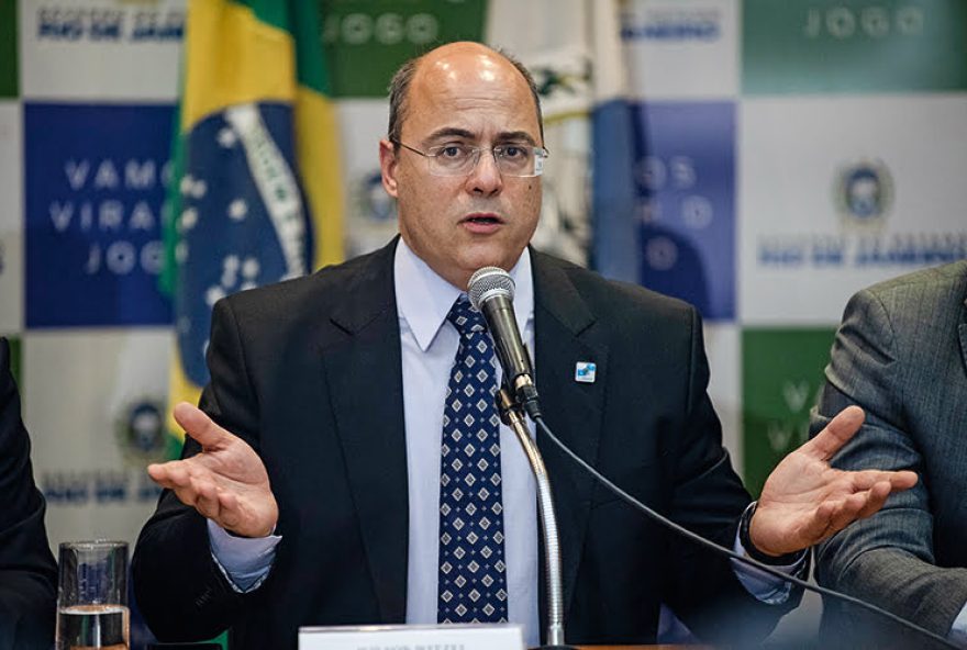 (FILES) In this file photo taken on September 23, 2019 Rio de Janeiro's Governor Wilson Witzel gestures during a press conference in Rio de Janeiro, Brazil, after eight-year-old Agatha Sales Felix died during a police operation at the Alemao complex slum. - Massive amounts of government emergency funds to fight the pandemic say are being stolen in the world's second-hardest-hit country, experts saym as the rush to respond to COVID-19 is sideswiped by an older, endemic disease: corruption. Brazil has a long history of graft scandals. But even by Brazilian standards, the scope of the accusations is outrageous. Even football superstar Neymar got dragged in. His name and personal data were used to register for the 600-real monthly stimulus payments the federal government is paying poor Brazilians hit hard by lockdown measures. (Photo by MAURO PIMENTEL / AFP)