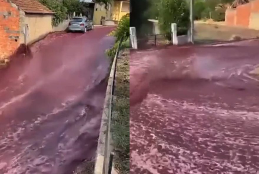 Enxurrada de vinho tinto percorrendo as ruas de Anadia após rompimento de dois depósitos. (Foto: Reprodução/Redes Sociais)