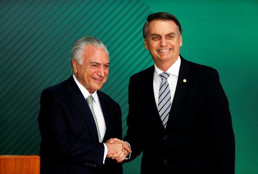 Brazil's President-elect Jair Bolsonaro (R) and Brazil's President Michel Temer shake hands, at the Planalto Palace in Brasilia, Brazil November 7, 2018. REUTERS/Adriano Machado