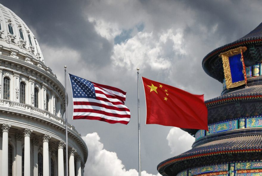 US and Chinese national symbols: The Capitol in Washington DC and Temple of Heaven in Beijing with national flags