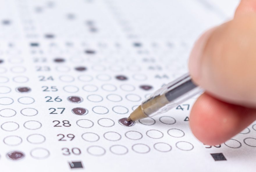 Hand,Filling,Out,An,Exam,Answer,Sheet,With,A,Pen, Hand,Filling,Out,An,Exam,Answer,Sheet,With,A,Pen,