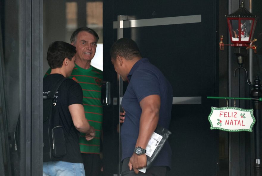 Brazil's former President Jair Bolsonaro appears in the doorway of his house, during his house arrest, in Brasilia, Brazil, November 21, 2025. REUTERS/Mateus Bonomi ORG XMIT: PPP-AMP01