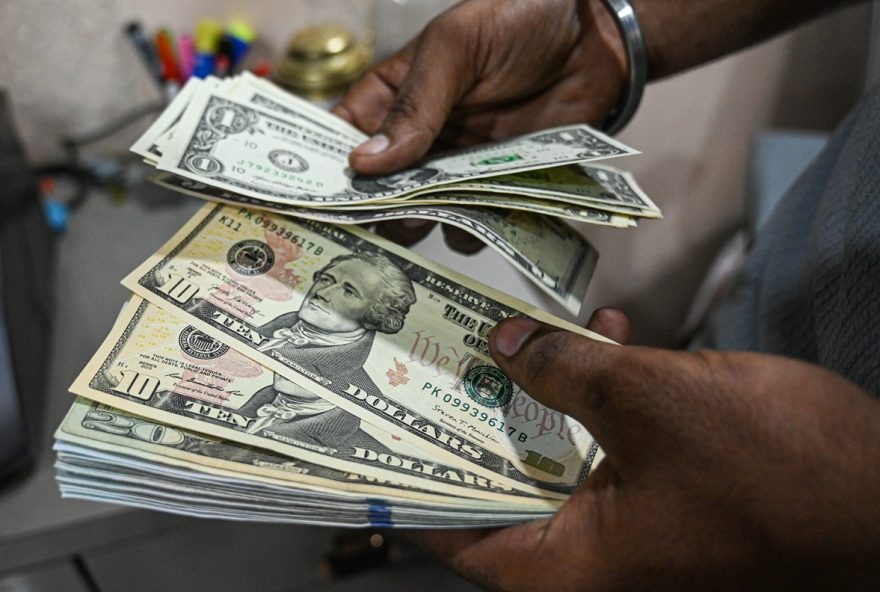 Currency Exchanges in New Delhi as Indian Rupee Falls to Record on Worries About US Tariff Impact An employee counts US dollora banknotes at a currency exchange store in New Delhi, India, on Saturday, Aug. 30, 2025. Photographer: Prakash Singh/Bloomberg
