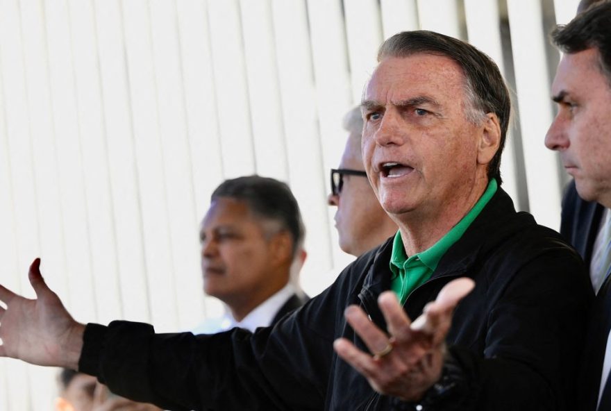 (FILES) Former Brazilian President Jair Bolsonaro speaks to the press at the Federal Senate in Brasilia on July 17, 2025. Former Brazilian president Jair Bolsonaro, sentenced to 27 years in prison for attempted coup, was placed in pre-trial detention on November 22, 2025, according to his lawyer and a source close to the case. (Photo by Mateus Bonomi / AFP)