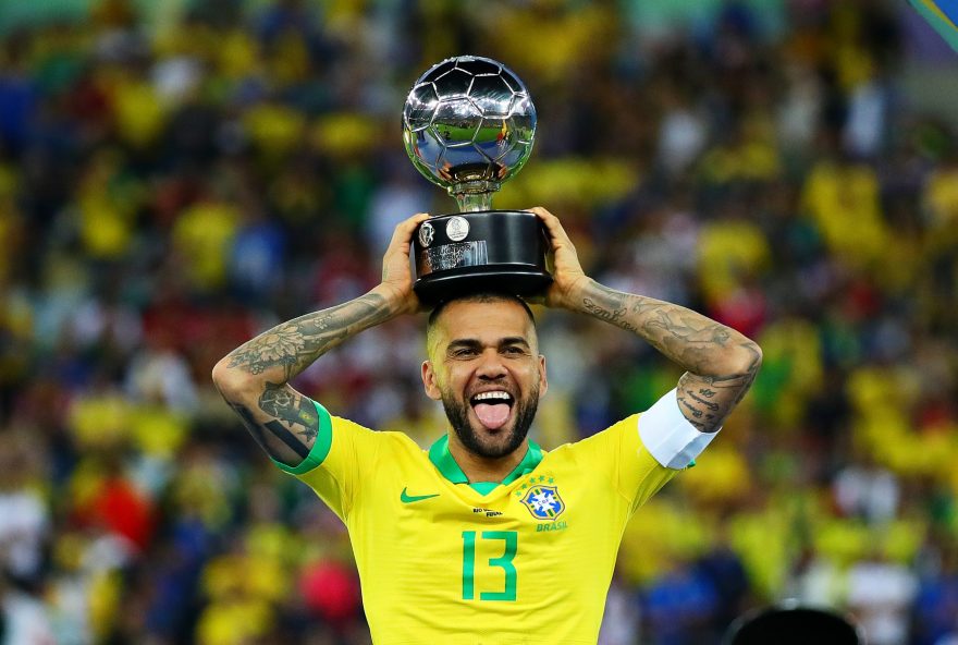 RIO DE JANEIRO, BRAZIL - JULY 07: Dani Alves of Brazil is presented with the Player of the Tournament trophy after the Copa America Brazil 2019 Final match between Brazil and Peru at Maracana Stadium on July 07, 2019 in Rio de Janeiro, Brazil. (Photo by Chris Brunskill/Fantasista/Getty Images)