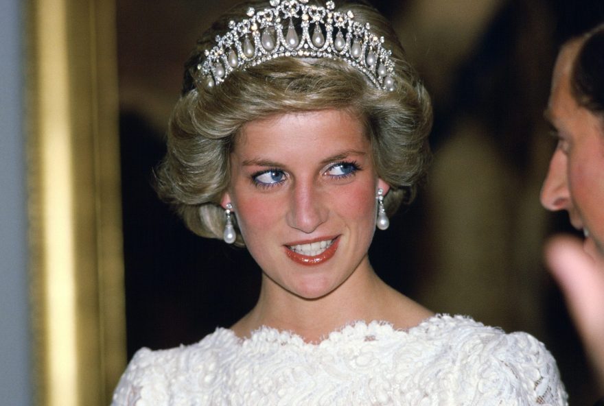 WASHINGTON, UNITED STATES - NOVEMBER 11:  Diana, Princess Of Wales, Talking To Her Husband, During A Visit To The British Embassy.  The Princess Is Wearing A Taffeta And Lace Gown With A Scalloped Neckline Designed By Murray Arbeid With Queen Mary's Diamond And Pearl Tiara, A Present From The Queen.  (Photo by Tim Graham/Getty Images)