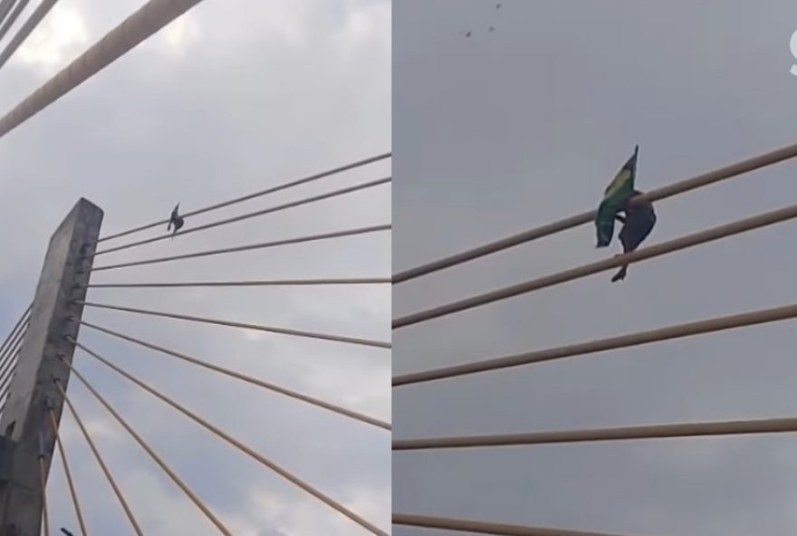 homem-escalando-ponte-em-imperatriz-para-fixar-bandeira-do-brasil3A-video-viraliza