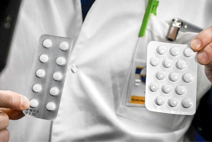 (FILES) In this file photo taken on February 26, 2020 medical staff shows at the IHU Mediterranee Infection Institute in Marseille, packets of a Nivaquine, tablets containing chloroquine and Plaqueril, tablets containing hydroxychloroquine. - Canadian health authorities have issued a warning against the use of anti-malarial drugs chloroquine and hydroxychloroquine to treat coronavirus infections or prevent reinfections. (Photo by GERARD JULIEN / AFP)