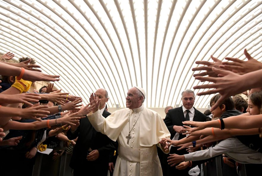 This handout picture released by the Vatican press office shows Pope Francis during an audience with children from middle schools across Italy belonging to the 