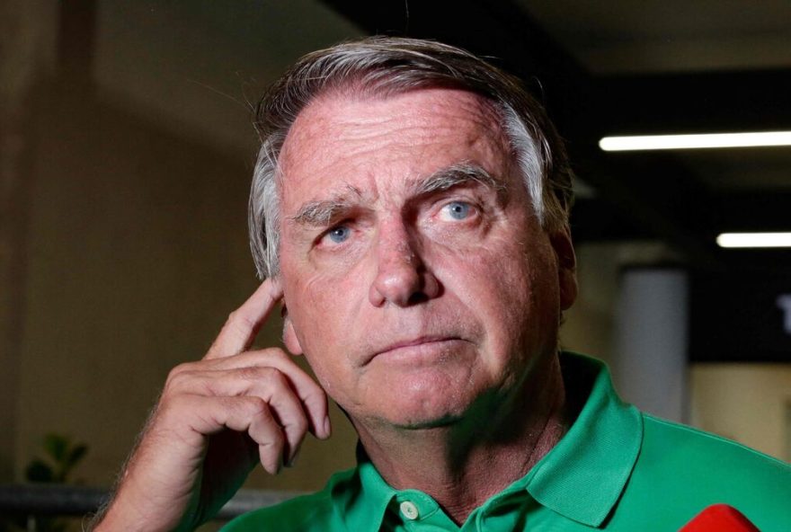 (FILES) Former Brazilian President (2019-2022) Jair Bolsonaro gestures during a press conference about his defense in the Supreme Court case on acts against Brazilian democracy on January 8, 2023, on arrival at Brasilia airport on March 6, 2025. Brazil's Supreme Court rejected a request for house arrest on health grounds made by former President Jair Bolsonaro, who is in prison for an attempted coup, according to a court ruling published on January 1, 2026. (Photo by Sergio Lima / AFP)