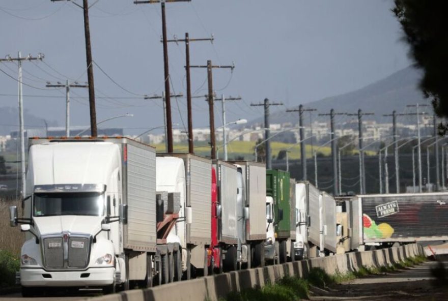 US-TRADE-TARIFFS-DIPLOMACY Trucks travel by the US-Mexico border after crossing the border into the US at Otay Mesa, California, on April 2, 2025. US President Donald Trump is poised to unveil sweeping new