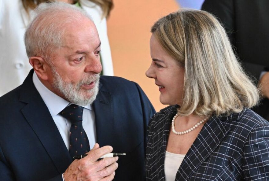 Brazil's President Luiz Inacio Lula da Silva (L) talks to the new minister of the Secretariat of Institutional Relations, Gleisi Hoffmann, during her swearing-in ceremony at the Planalto Palace in Brasilia on March 10, 2025. Hoffmann replaces Alexandre Padilha as minister. (Photo by EVARISTO SA / AFP)
