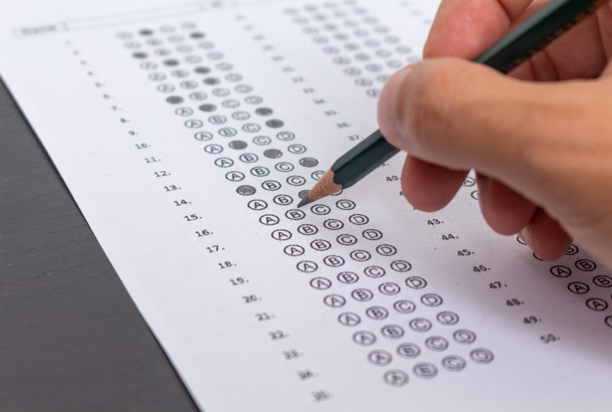 Hand,Filling,Out,An,Exam,Answer,Sheet,With,A,Pencil, Hand,Filling,Out,An,Exam,Answer,Sheet,With,A,Pencil,