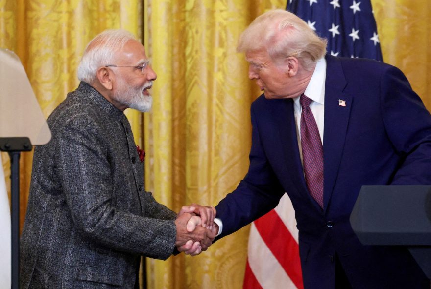 FILE PHOTO: U.S. President Donald Trump and Indian Prime Minister Narendra Modi shake hands as they attend a joint press conference at the White House in Washington, D.C., U.S., February 13, 2025. REUTERS/Kevin Lamarque/File Photo