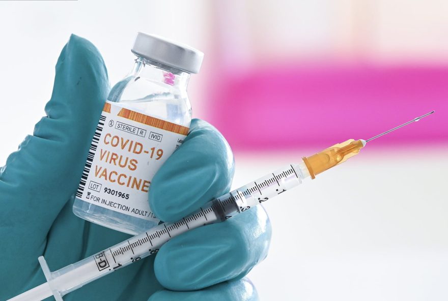 BRUSSELS, BELGIUM - JUNE 18 : In this illustration a doctor holds a syringe and a bottle labelled as the Covid-19 coronavirus vaccine. At least 8,000,202 cases of infection, including 435,176 deaths, were recorded in total, particularly in Europe, the continent most affected with 2,417,902 cases (188,085 deaths) and in the United States, which has the highest number of cases (2,110,182) and deaths (116,081). There are about a hundred projects for vaccines against Covid-19, of which about ten are in the clinical trial phase. Pictured on June 18, 2020 in Brussels, Belgium, 18/06/2020 ( Photo by Vincent Kalut / Photonews via Getty Images)